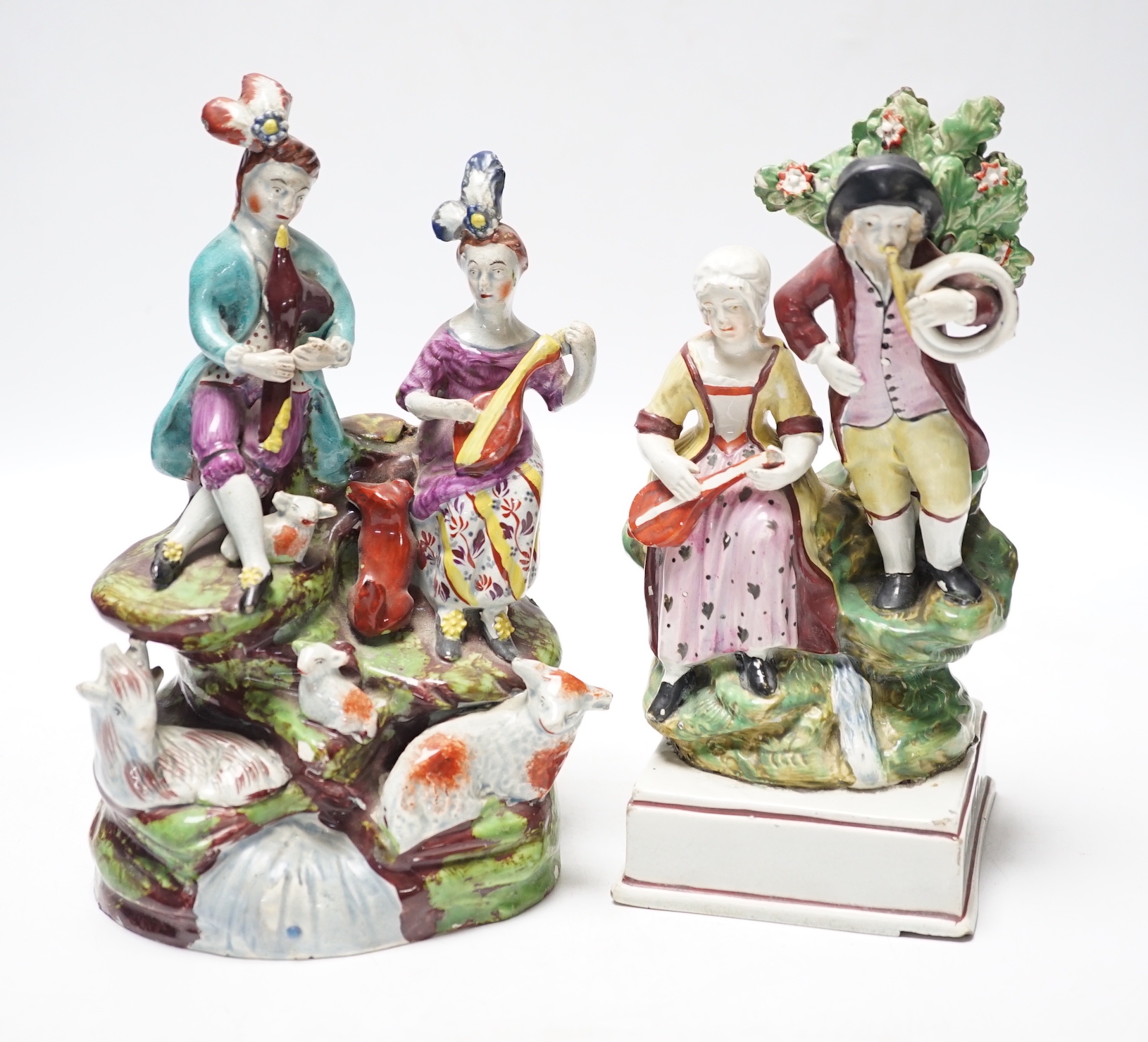 Two Staffordshire pearlware groups of musicians, c.1810-25, largest 20cm high
